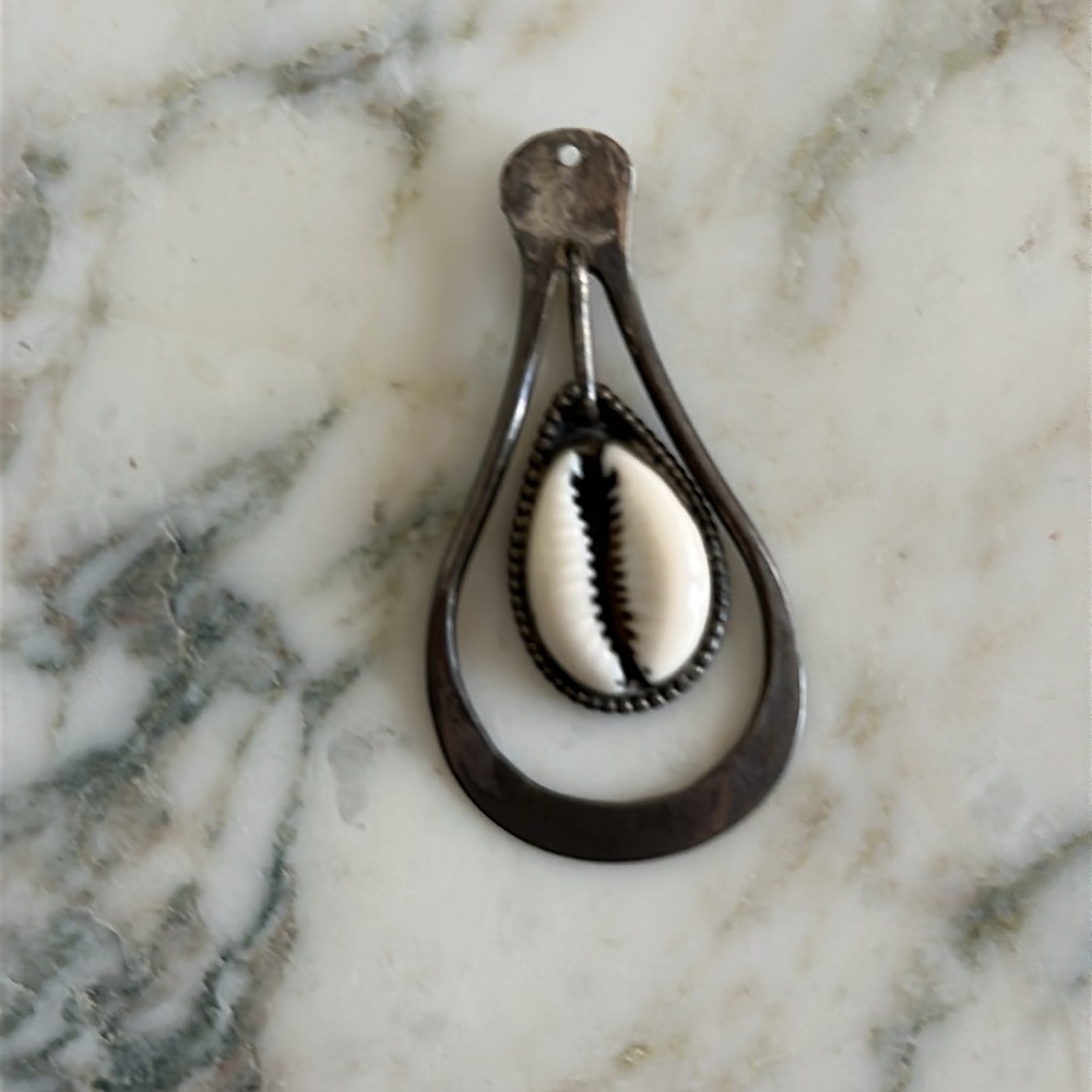 Silver and White Cowrie Shell Pendant likely sterling